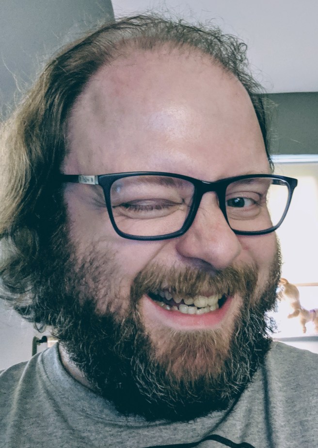 A selfie of the review's author winking conspiratorially.